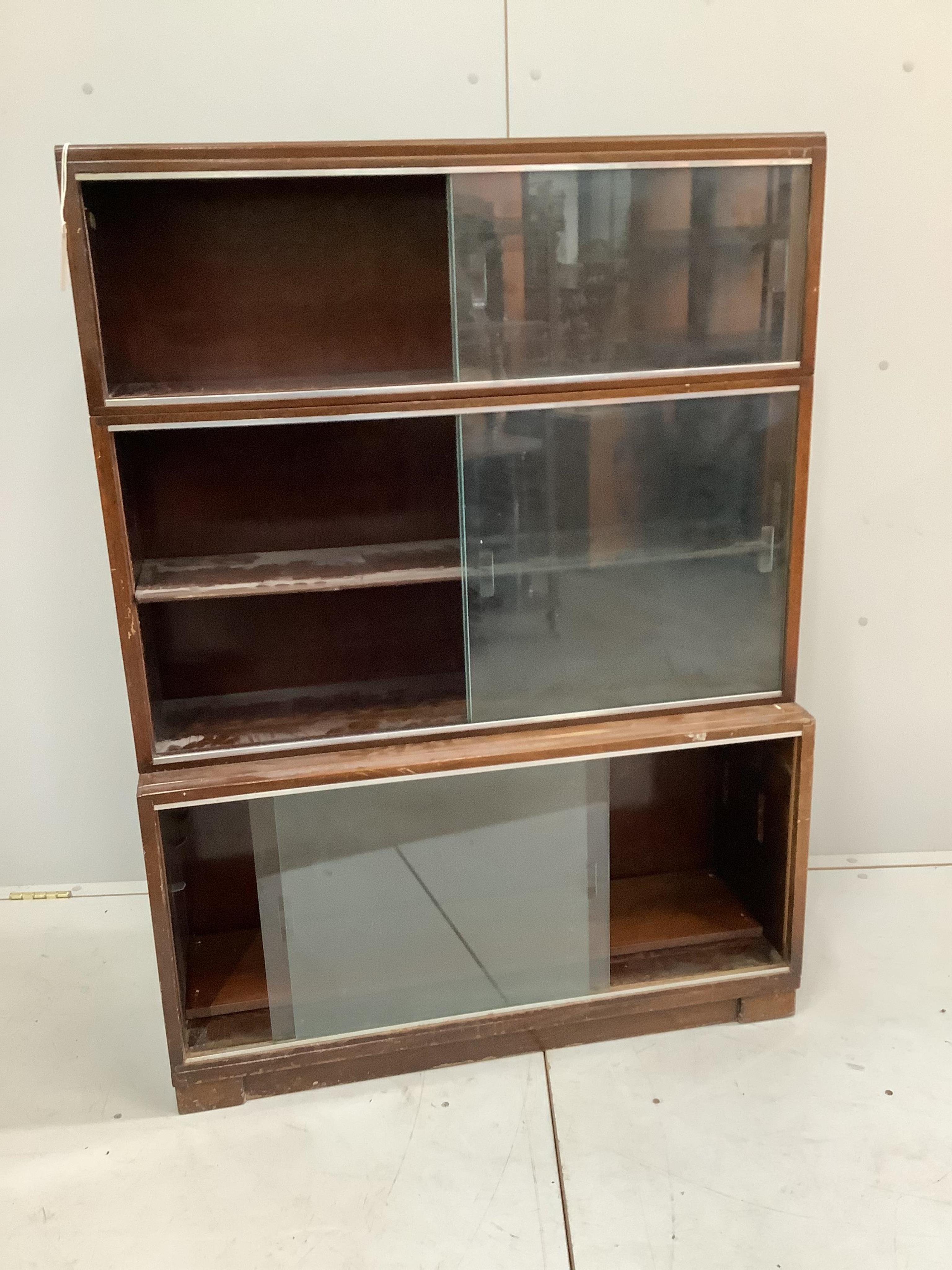 A mid century Minty style mahogany three section bookcase, width 89cm, depth 29cm, height 121cm. Condition - fair